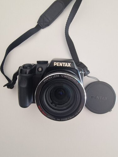 Περισσότερες πληροφορίες για "Φωτογραφική μηχανή Pentax x70 - 24x zoom - 12 megapixels με ολα τα αξεσουάρ και θήκη."