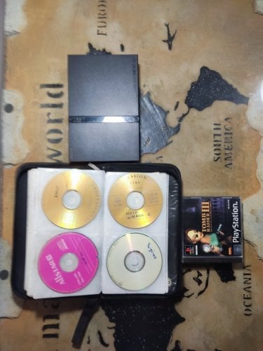 Περισσότερες πληροφορίες για "Playstation 2 black & Tomb Radier III console & Plastation CD case"